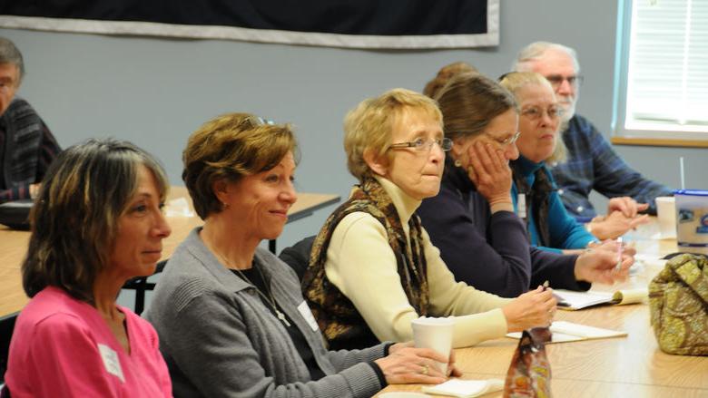 Group of older adults at SAGE lecture