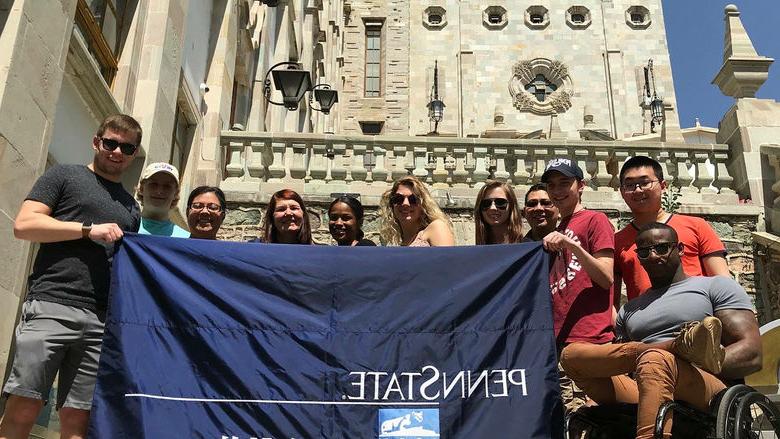 Group of students with PSU-LV banner in Mexico