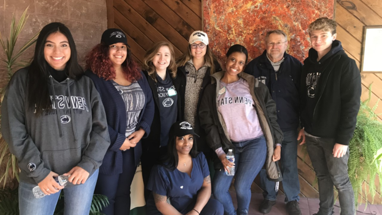 group of students and professor at food bank
